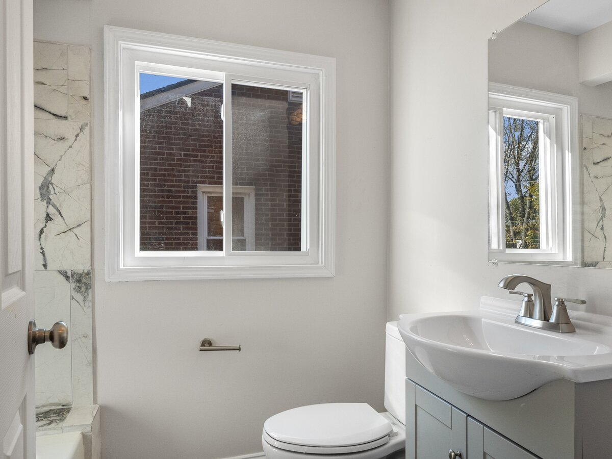 Finished bathroom with pedestal sink